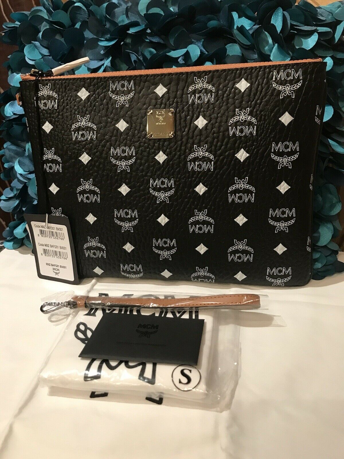 Mcm black clutch online bag